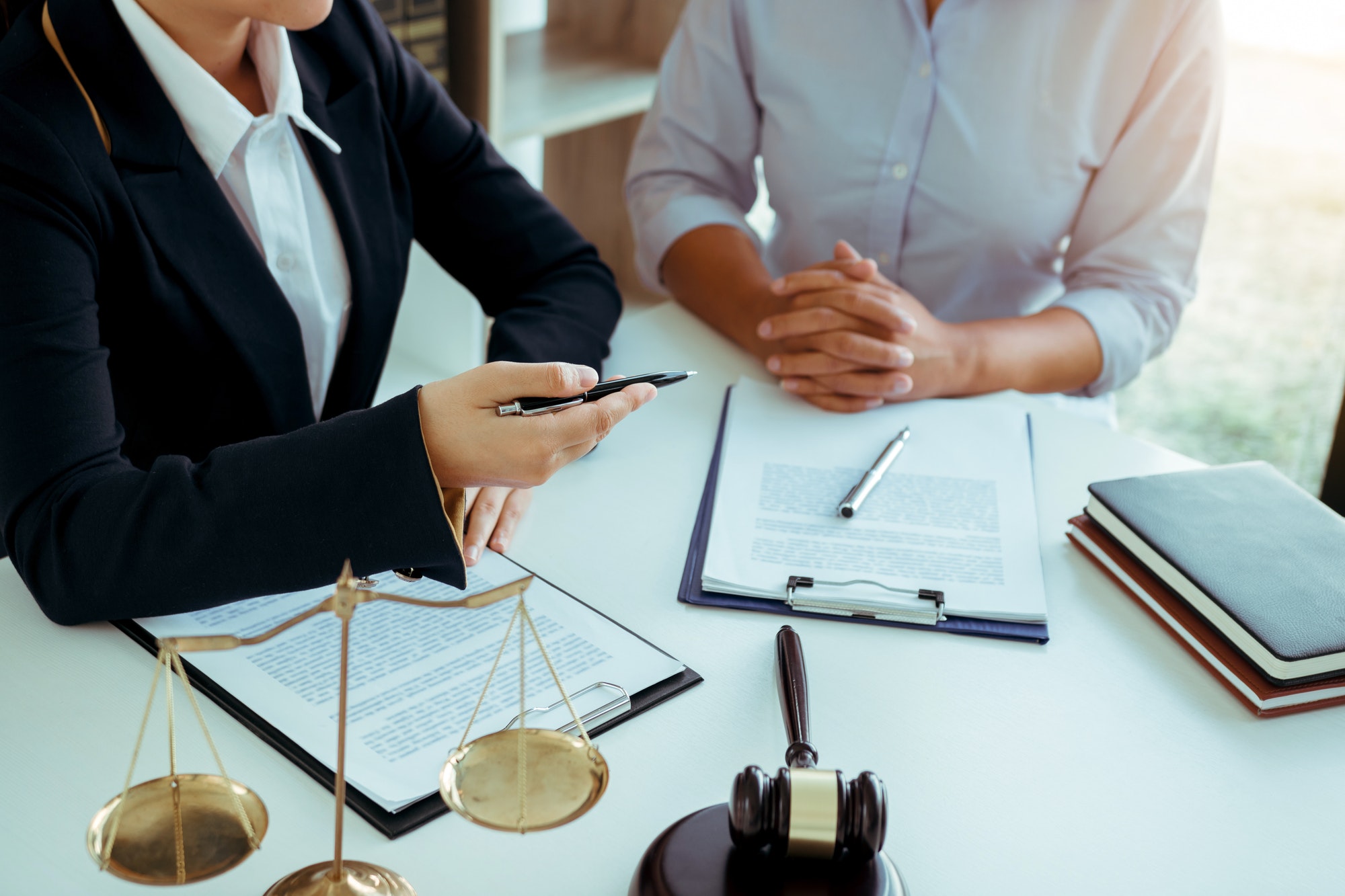 Business lawyer is currently counseling the client's trial at the lawyer office.